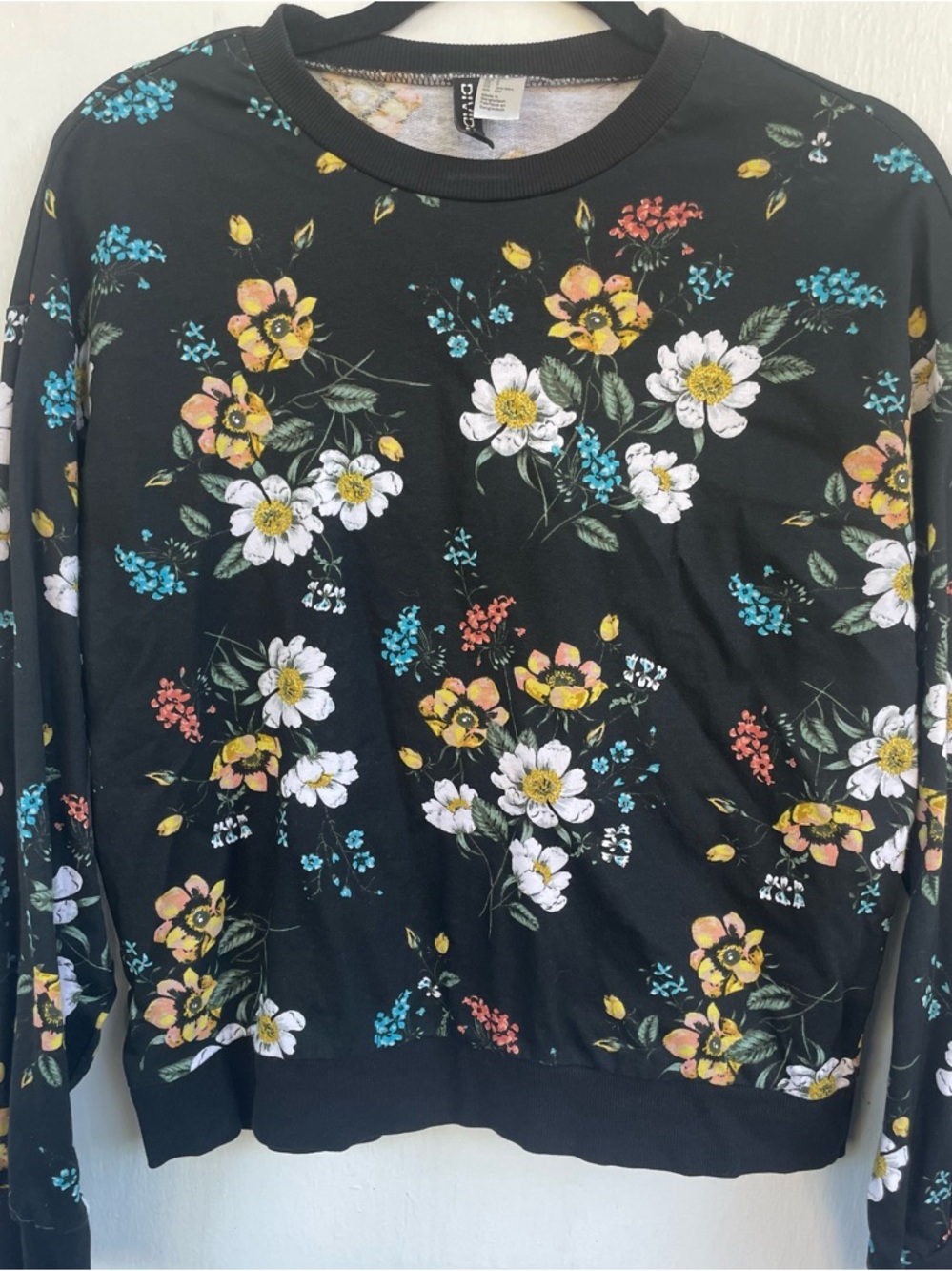 H&M Black Sweatshirt with Yellow and Teal Floral Print
